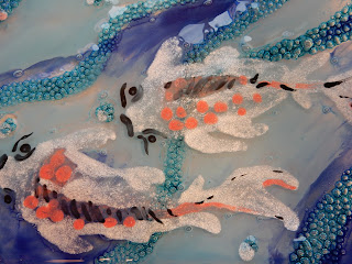 Close-up of the painted koi water. Bubbles and sparkle!