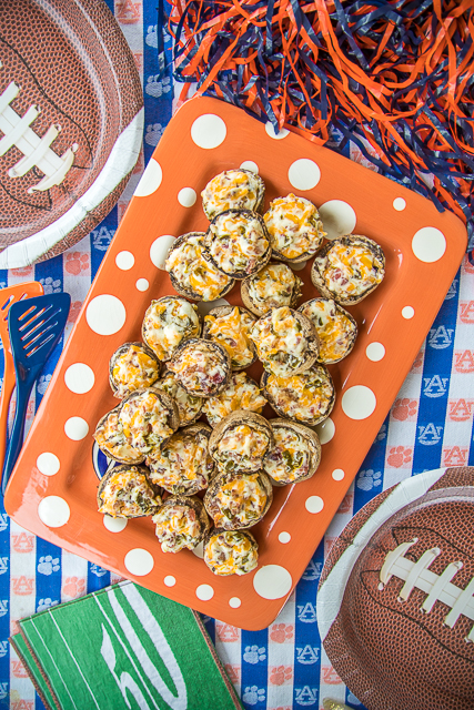 Jalapeno Popper Mushrooms - always the first thing to go at parties! Mushrooms stuffed with cream cheese, garlic, cheddar cheese, bacon and jalapeños. Seriously delicious! Can prep mushrooms ahead of time and refrigerate until ready to bake. Great for parties or a low-carb snack. #partyfood #mushrooms #jalapenopoppers Jalapeno Popper Mushrooms - always the first thing to go at parties! Mushrooms stuffed with cream cheese, garlic, cheddar cheese, bacon and jalapeños. Seriously delicious! Can prep mushrooms ahead of time and refrigerate until ready to bake. Great for parties or a low-carb snack. #partyfood #mushrooms #jalapenopoppers