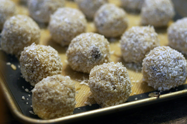 arancini all lined up on a tray ready to be fried