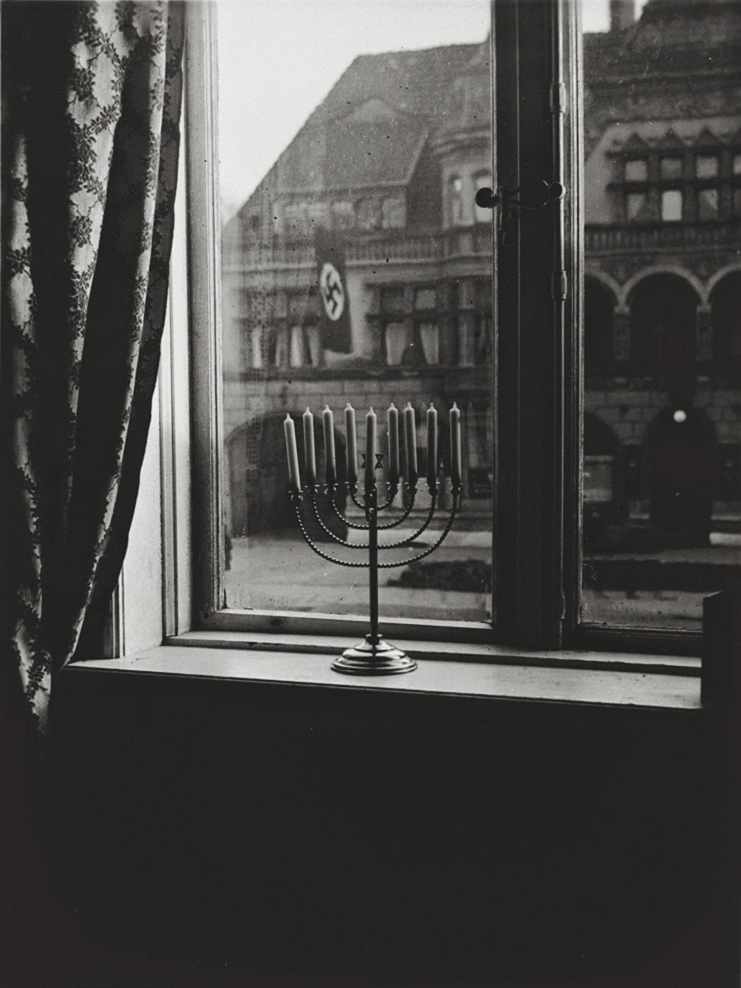 She wrote a few lines in German on the back of the photo. “Chanukah, 5692. ‘Judea dies’, thus says the banner. ‘Judea will live forever’, thus respond the lights.”