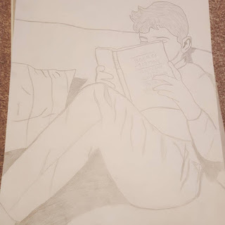 a pencil drawing of Dan Jon reading his Scriptures