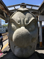 A giant stone statue of Tengu at Takao Station