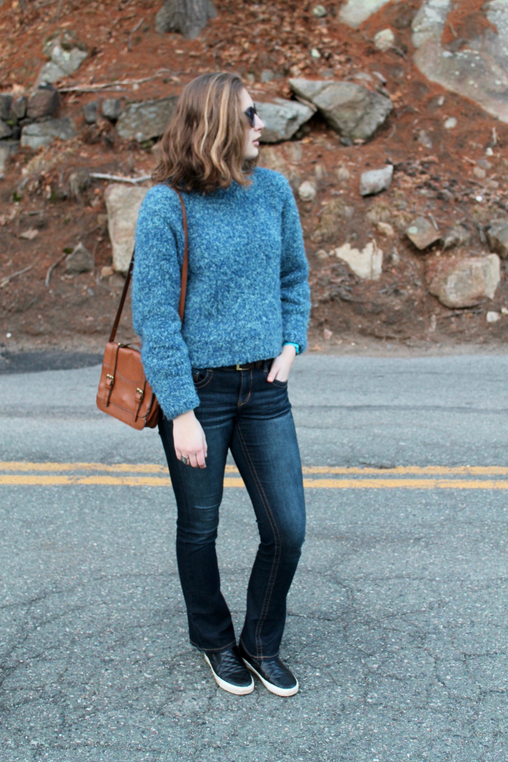 Blue handmade knit sweater, LA Hearts blue reflective sunglasses, bootcut dark washed jeans and leather slip on sneakers