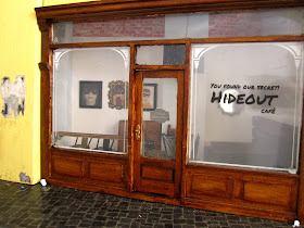 Modern dolls' house miniature cafe exterior.