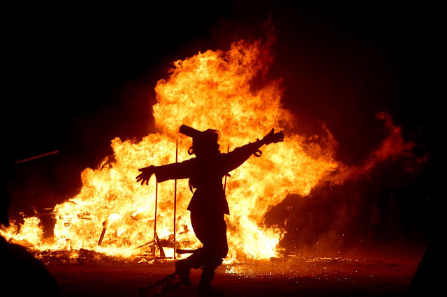 Iranians arund a large bonfire in Chaharshanbeh Soori ceremony. Iran
