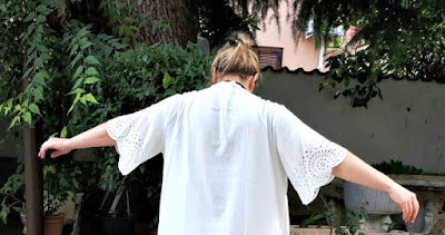 http://it.shein.com/White-Laser-Cutout-Scallop-Trim-Long-Kimono-p-308471-cat-1878.html
