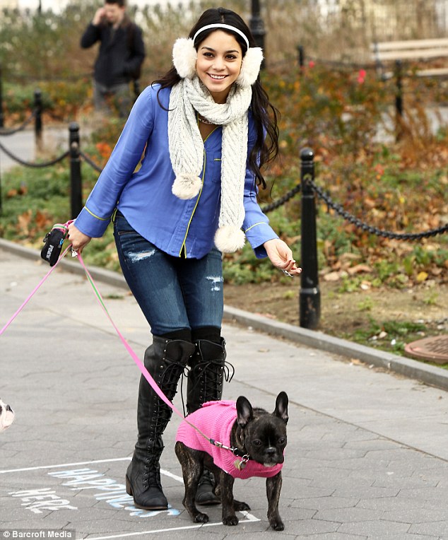 Vanessa Hudgens dresses her puppies in pink coats for a
