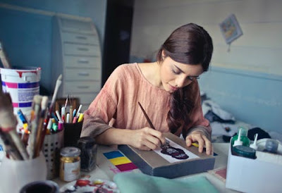 how to improve memory and concentration woman painting