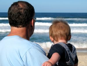 Image: Grandfather and grandson looking out to sea. Photo credit: Annette Sparrow on FreeImages