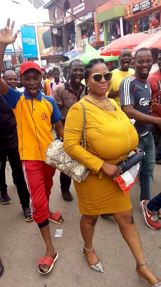 Woman with very huge boobs causes commotion in Lagos (Photos)