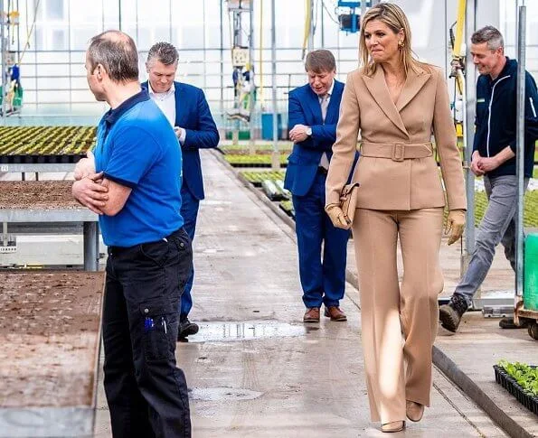 Claes Iversen couture women suits. Queen Maxima wore a camel belted blazer and wide leg trousers by Claes Iversen