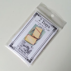 One-twelfth scale miniature tray kit in packaging.