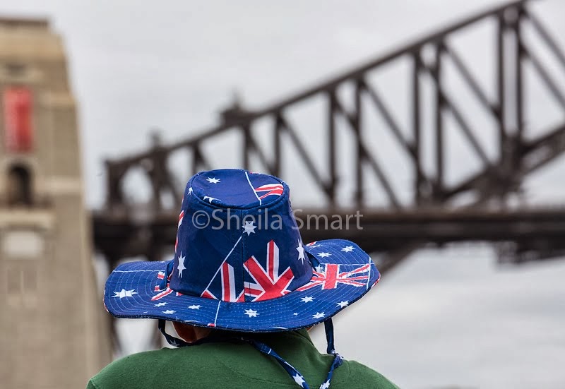Man in flag hat with Bridge backdrop