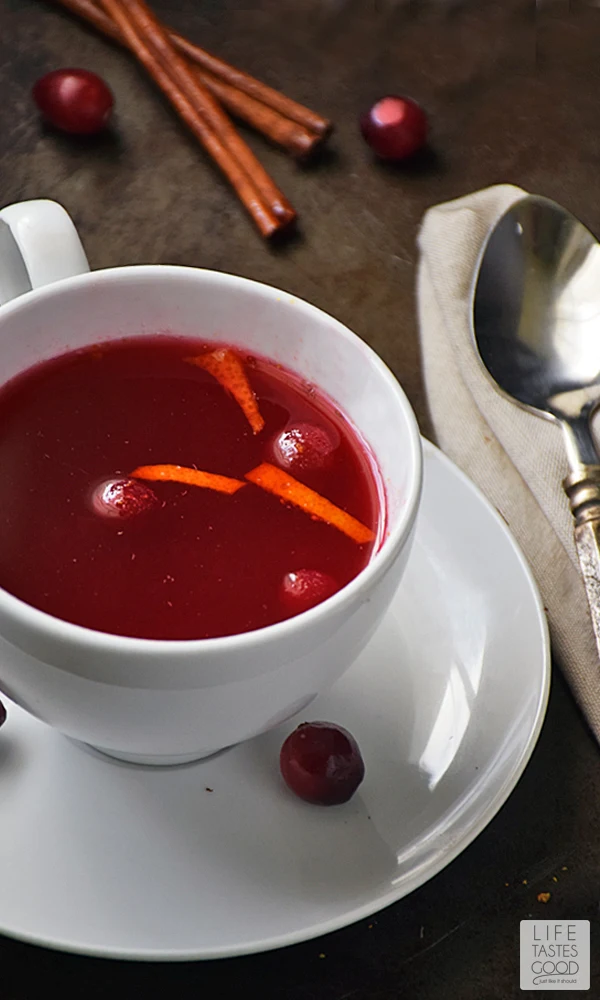 Cranberry Tea | by Life Tastes Good with its deep, ruby red color has a festive feeling perfect for the holiday season! Spiced with cinnamon and cloves, it's as comforting as snuggling under a warm blanket on a cold morning...with puppies! Lots of puppies <smile> #LTGrecipes #RHFood