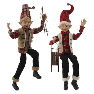 Christmas elf in flannel, sheep skin, sled and ski poles