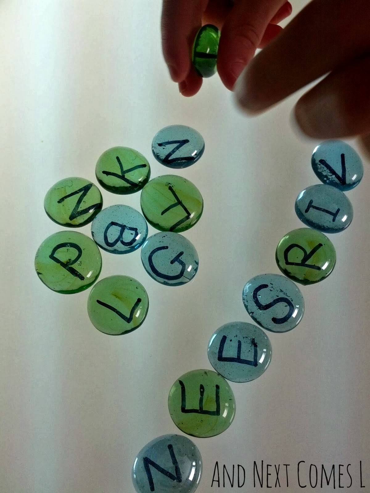 DIY alphabet stones for light table play from And Next Comes L