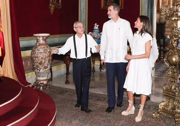 Queen Letizia wore Adolfo Dominguez embroidered cotton dress with belt. Letizia wore a new aquamarine blue midi dress