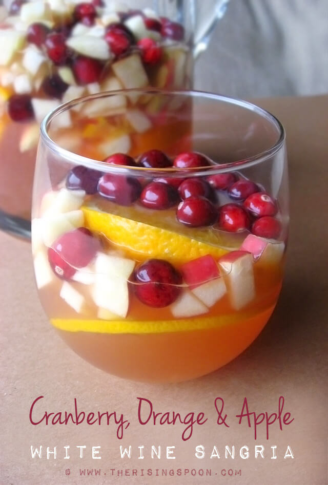 An easy white wine sangria recipe featuring gorgeous fall and winter ingredients like cranberries, apples, and oranges. This drink is refreshing, not too sweet, and even slightly healthy with the addition of 100% unsweetened cranberry juice. It's elegant enough to serve at a holiday gathering, yet simple enough for a low-key weeknight dinner. (gluten-free & paleo)