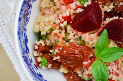 A colourful couscous salad with roasted red peppers, sundried tomatoes, capers and baby beets as well as a few added ingredients for extra flavour and tips on achieving the easiest fluffy couscous.