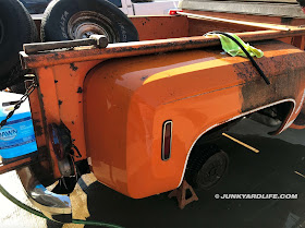 The orange bed shines after layers of surface rust and grime are removed.