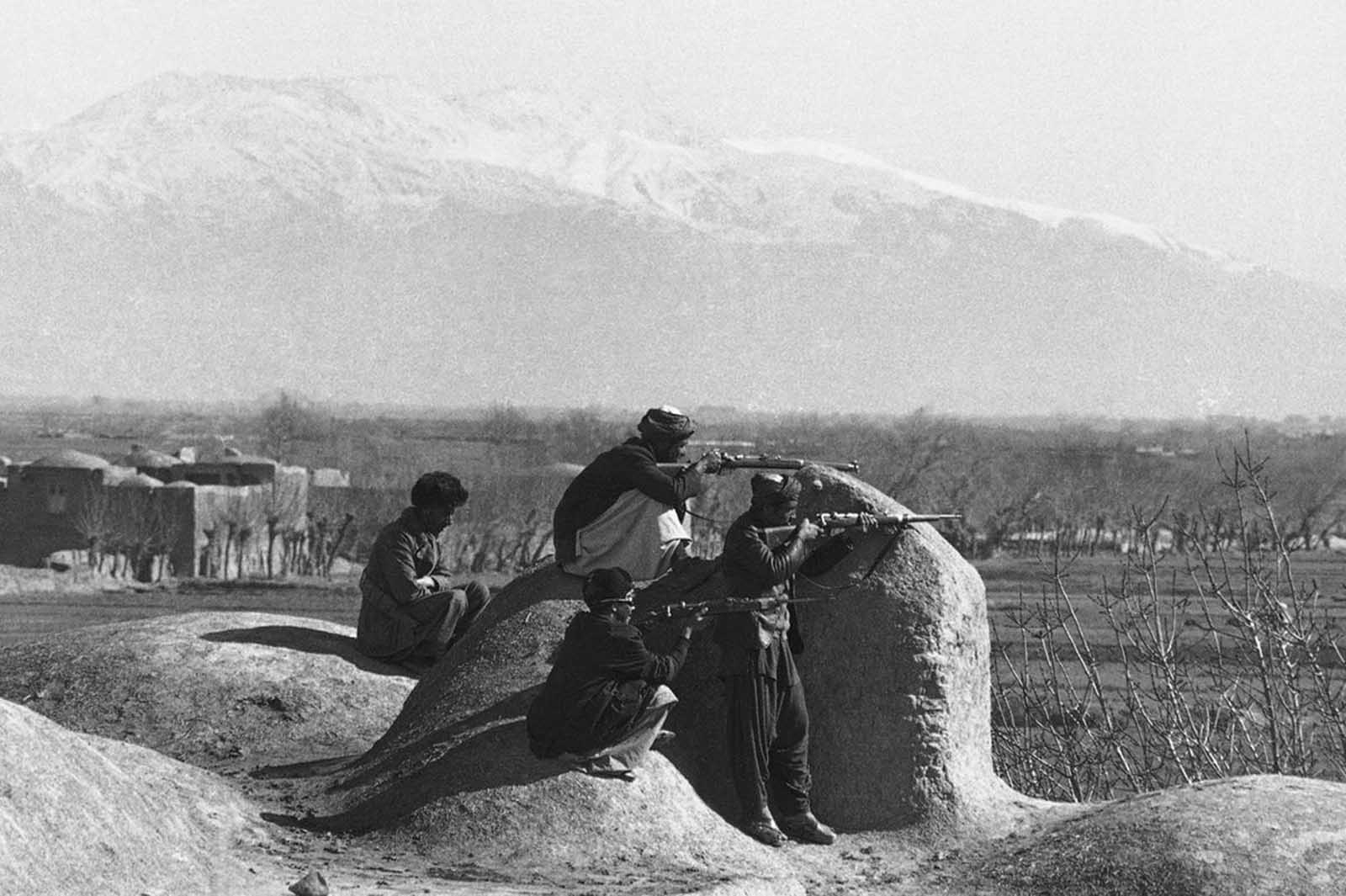 Mujahedeen positioned on rooftops about 10 kilometers from Herat, keeping watch for Russian convoys, on February 15, 1980.