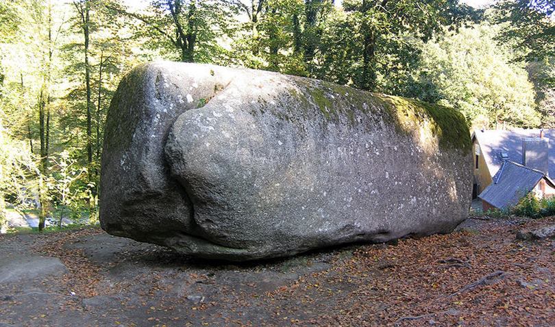 The Trembling rock weighs 137 tonnes and is 7 meters in length. It is pivoted in such a way that it can be moved if you know the right place to push. These huge lumps of granite are also known as Logan stones.