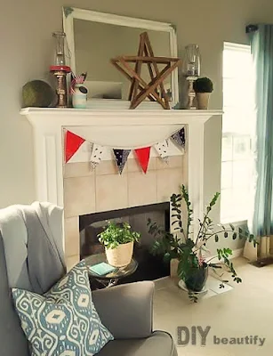 Create a 4th of July Mantel on the cheap by borrowing items from around your home! See it all at DIY beautify
