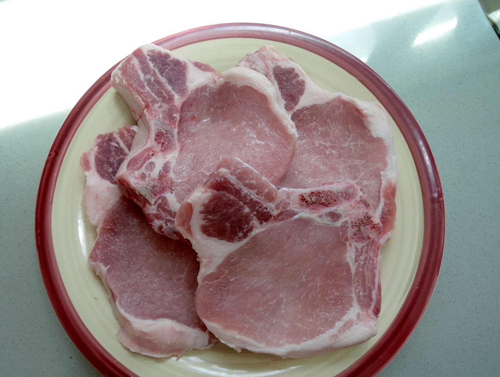 The Briny Lemon PanCooked Pork Chops with Plums and Mint