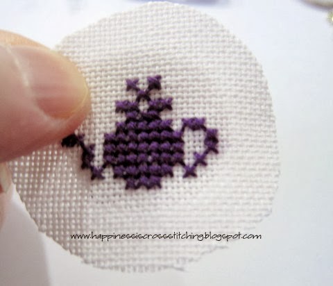 Teapot cross stitch design stitched on linen using dmc cotton threadss