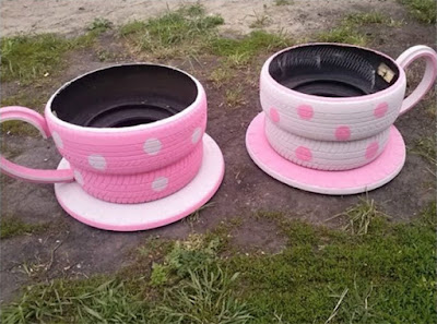 Tazas de te para un parque de diversiones para niños pintadas de color rosa y hechas con llantas