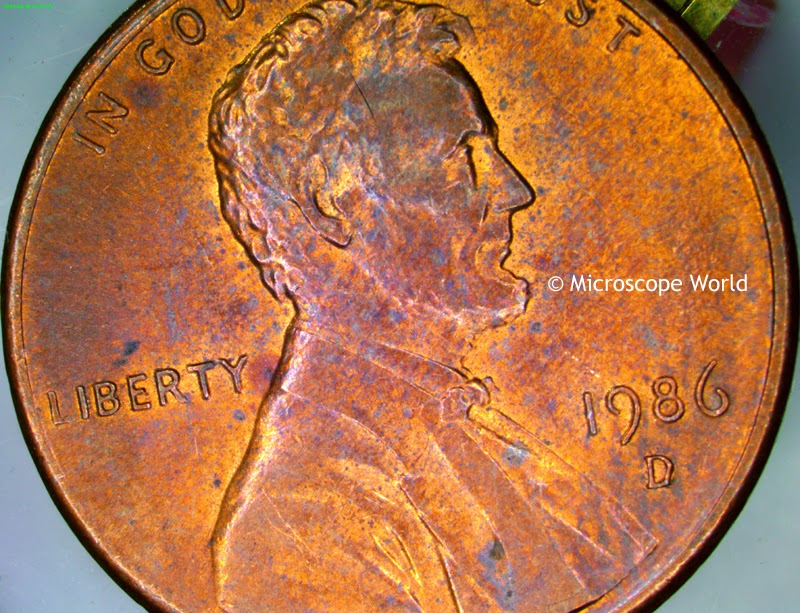 Penny under the microscope at 10x magnification.