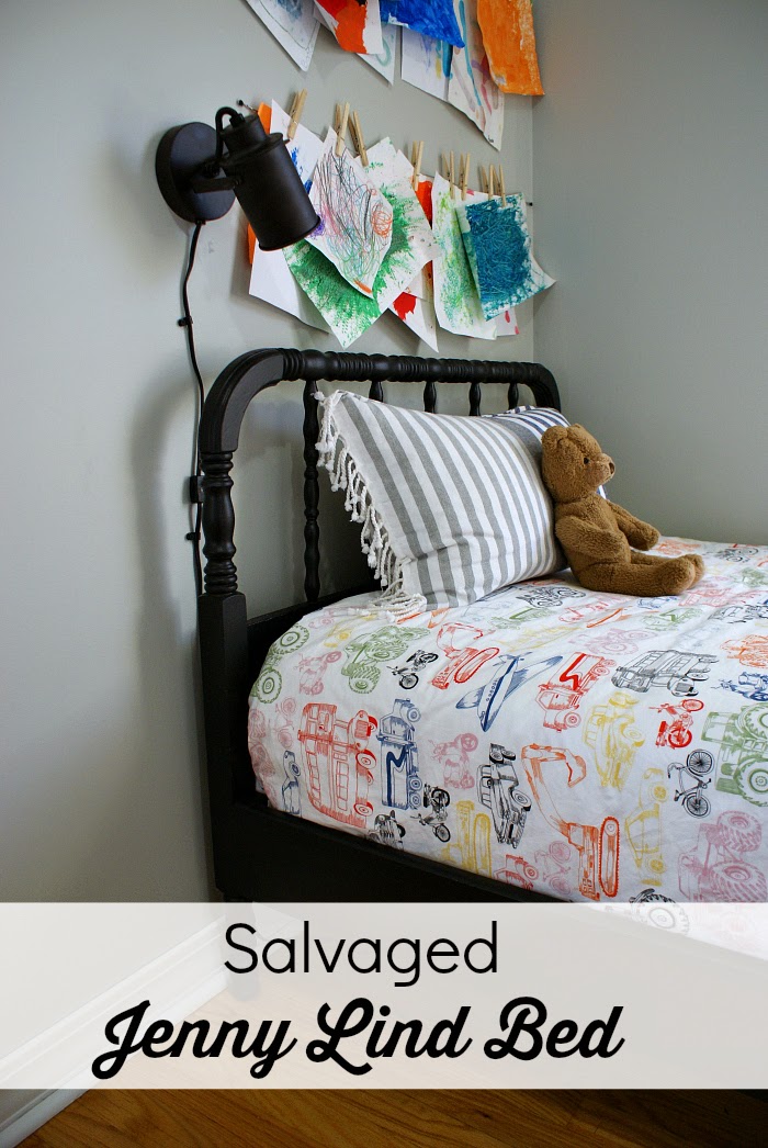 Salvaged black Jenny Lind style bed in boy's bedroom