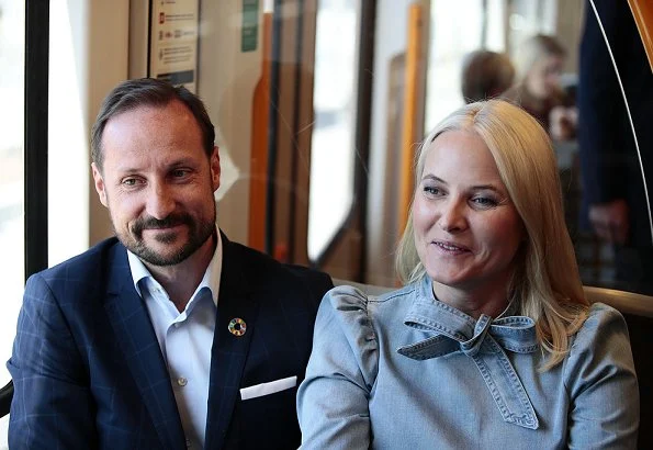 Crown Princess Mette-Marit wore ULLA JOHNSON Wes bow-embellished denim blouse. Crown Prince Haakon