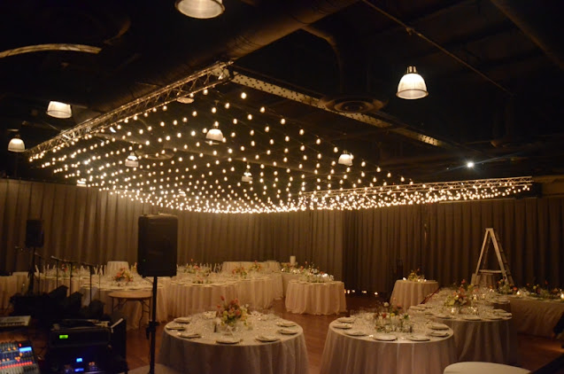 A canopy of lights with round G50 bulbs hanging over the dance floor at The Lighthouse at Chelsea Piers