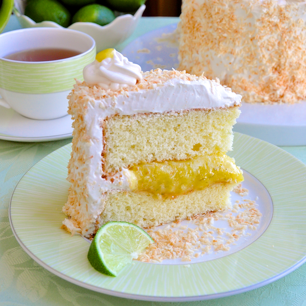 Coconut Lime Marshmallow Cake - a fantastic combination of flavors and textures including a light lime sponge cake, a tangy lime curd, fluffy marshmallow frosting and a generous coating of toasted coconut.