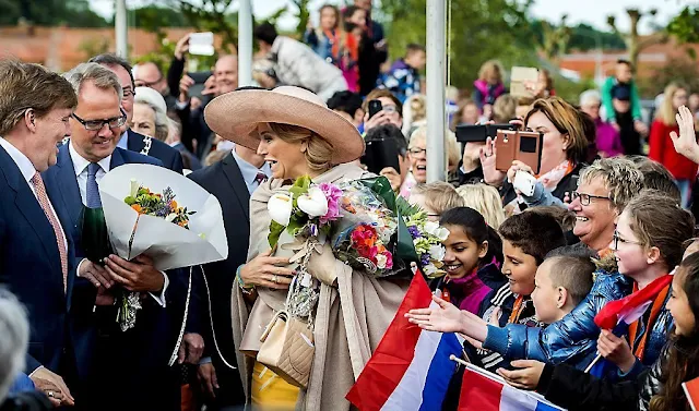 King Willem-Alexander and Queen Maxima visit during an region visit Zeeuws Vlaanderen