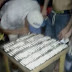 Shocking video shows DOZENS of Brazilian prisoners queuing up to snort COCAINE off a table at a party organised by one of the gangs controlling the jail