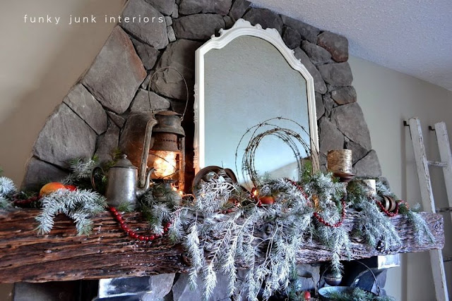 Junk inspired Christmas fireplace mantel decorating via Funky Junk Interiors