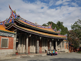 Group of young students in front of Ling-Xing Gate at the Taipei Confucius Temple