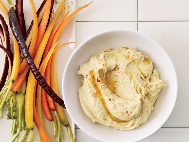 Easy Hummus with Tahini Easy Hummus with Tahini in a serving dish and carrot sticks