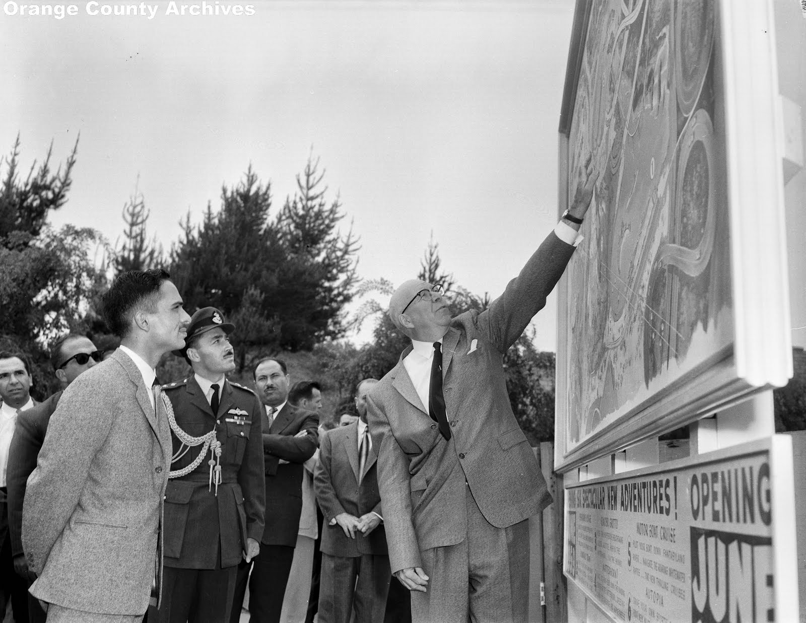 Fowler (right) shows King Hussein of Jordan a map of future Disneyland attractions, April 1959 (Orange County Archives/Public Domain)