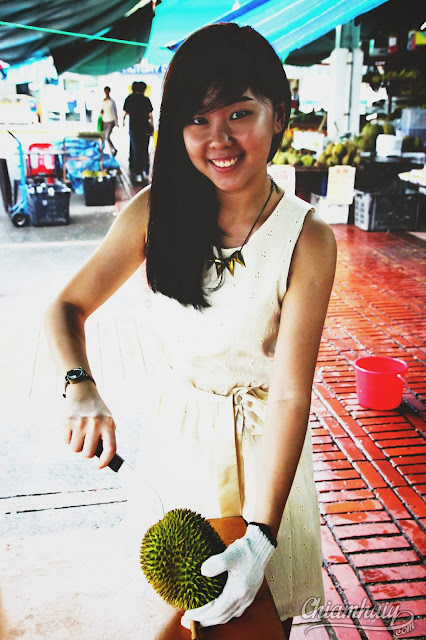 Girl+opening+durian+shell