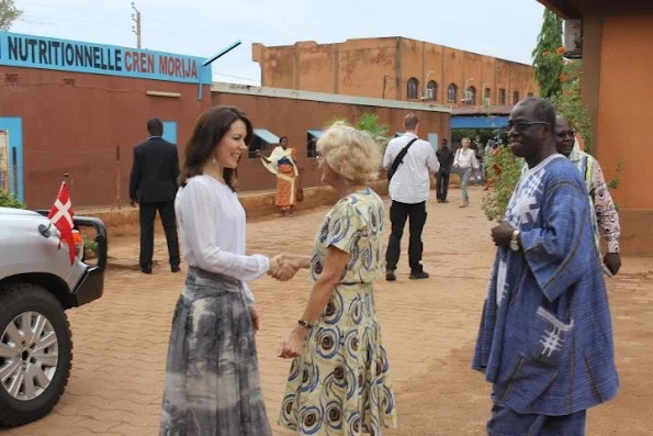 Crown Princess Mary of Denmark visited the various charitable projects. Princess Mary wore Heartmade dress