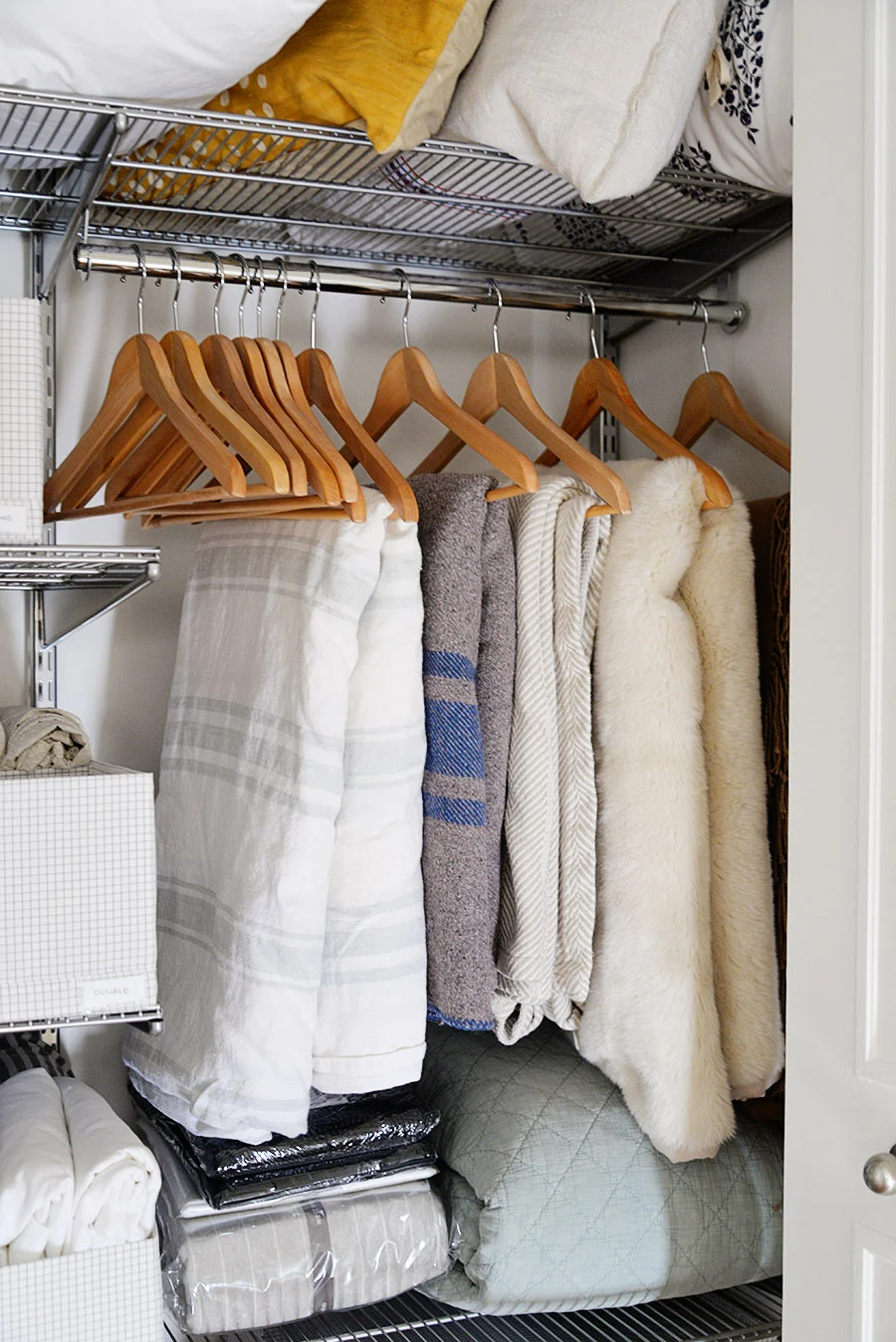 linen closet organization ideas, ideas for linen closet, how to store blankets, blankets on hangers