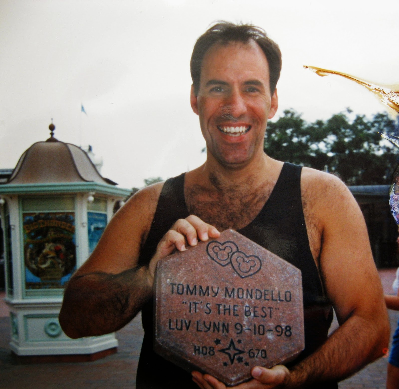 Tommy Mondello holding his Disney brick