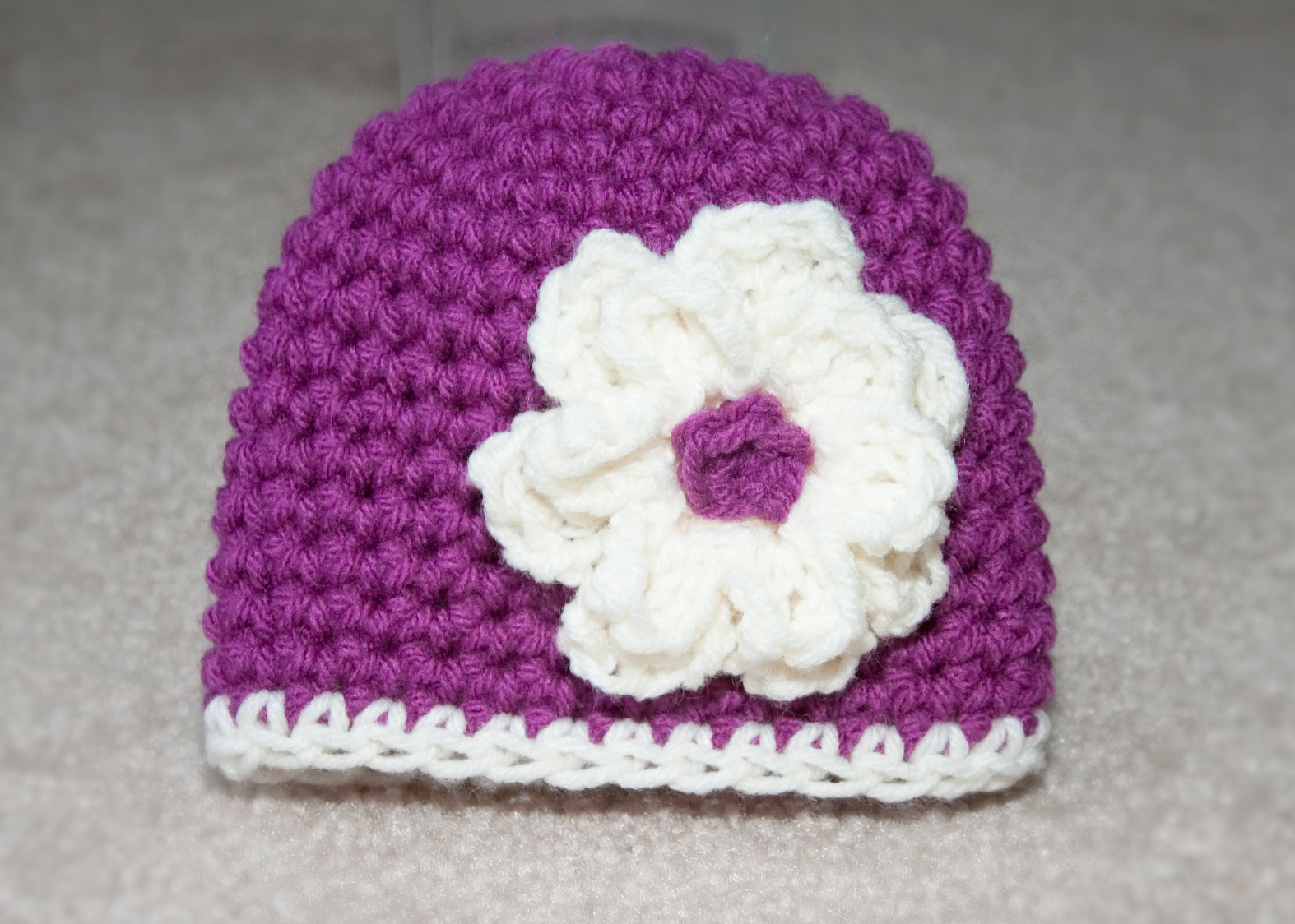 Crochet by Sheri Classic beanie with flower.