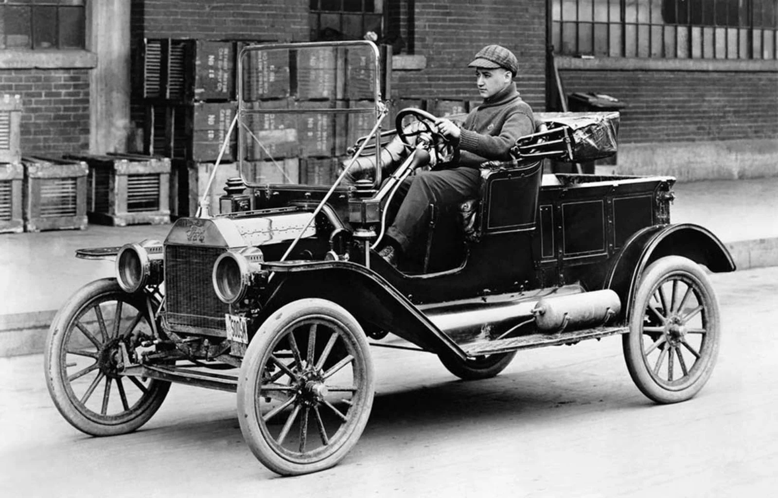 Man with his prized Model T Ford roadster ~