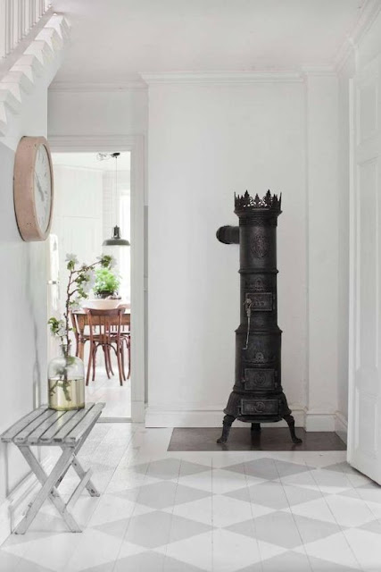 Breathtaking beautiful Swedish style foyer with checks painted on floors - found on Hello Lovely Studio