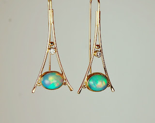 18k Ethiopean opal earrings 18k triangular shaped earrings with Ethiopian opals.