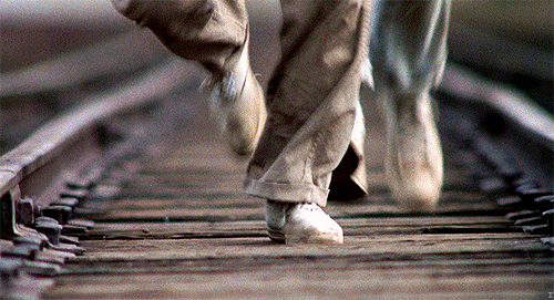 stand by me gif of characters running on train track